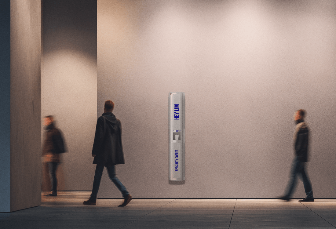 HEYLIM specialty coffee pillar in minimalist museum corridor with visitors walking past in warm ambient lighting